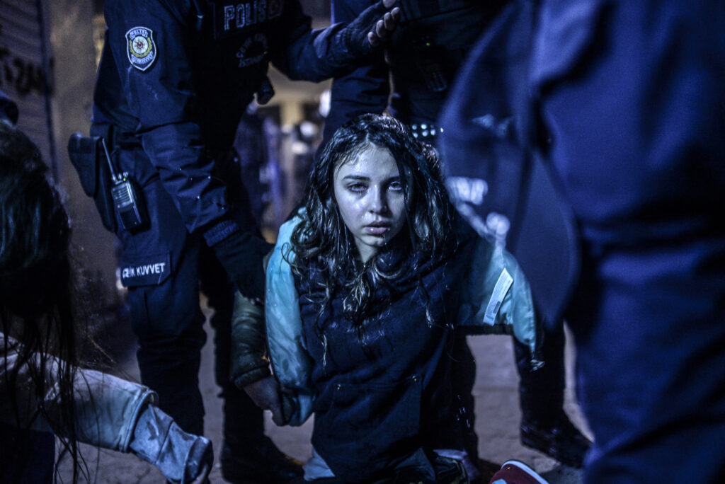A young girl is pictured after get wounded during clashing after the funeral of Berkin Elvan, the 15-year-old boy who died from injuries suffered during last year's anti-government protests, in Istanbul on March 12, 2014. Riot police fired tear gas and water cannon at protestors in the capital Ankara, while in Istbanbul, crowds shouting anti-government slogans lit a huge fire as they made their way to a cemetery for the burial of Berkin Elvan. AFP PHOTO/BULENT KILIC